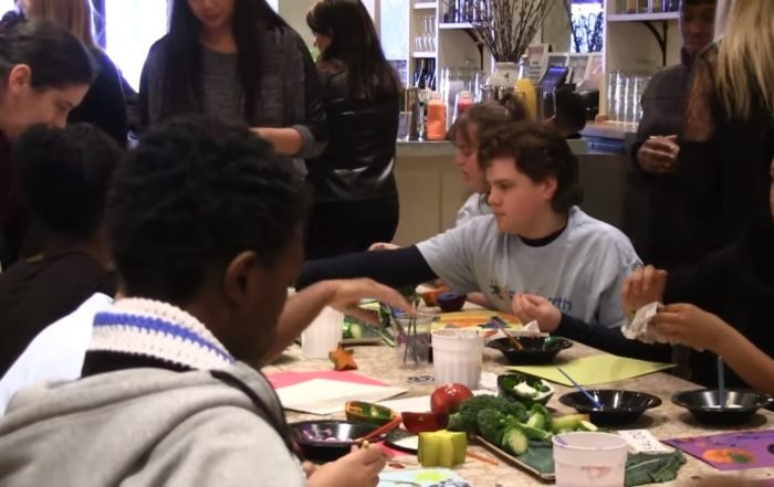 Participants preparing a shared meal in an eat-Able cooking class